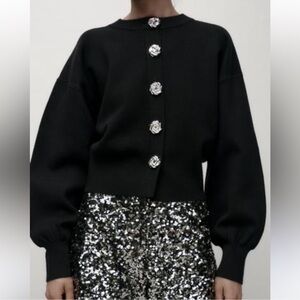 Elegant Black Sweater with Silver Rose Shaped Button Accents